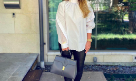 D’Andra Simmons’ White Buckle Neck Blouse