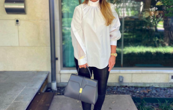 D’Andra Simmons’ White Buckle Neck Blouse
