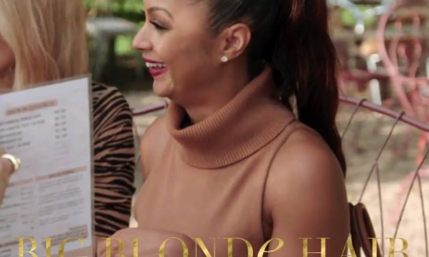 Eboni K. Williams’ Camel Turtleneck Tank