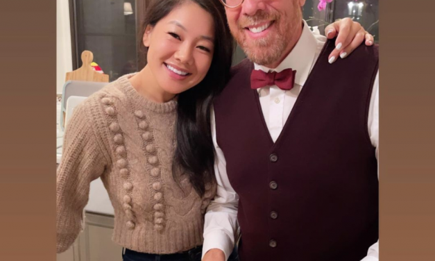 Crystal Kung Minkoff’s Beige Pom Pom Sweater