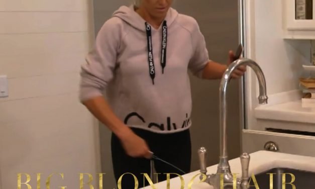 Olivia Flowers’ Pink and Black Logo Hoodie