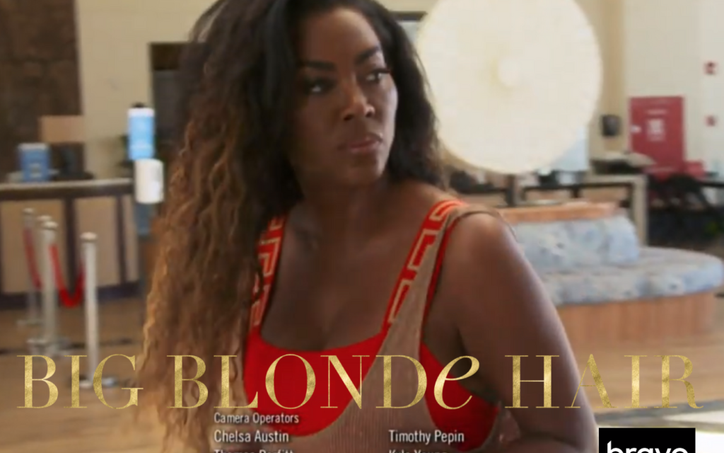 Kenya Moore’s Red One Piece Swimsuit