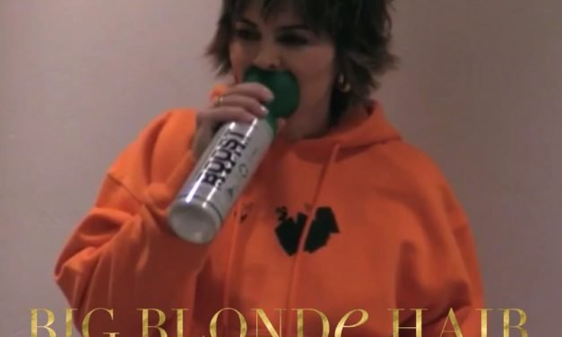 Lisa Rinna’s Yellow Sunglasses and Orange Sweatshirt