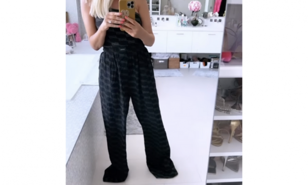 Caroline Stanbury’s Black Logo One Shoulder Bodysuit