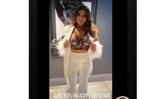 Dolores Catania’s White Feather Blazer and Pants