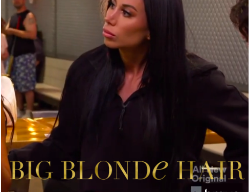 Rachel Fuda’s Black Half Zip Hooded Sweatshirt