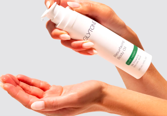 Meet the First Ever Glycolic Body Oil That Shoppers Say Erases Discoloration & Smoothes Arm Bumps Within 2 Weeks