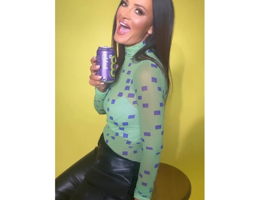 Lisa Barlow’s Green Printed Mesh Turtleneck