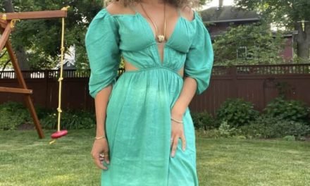 Ashley Darby’s Green Pleated Cutout Dress