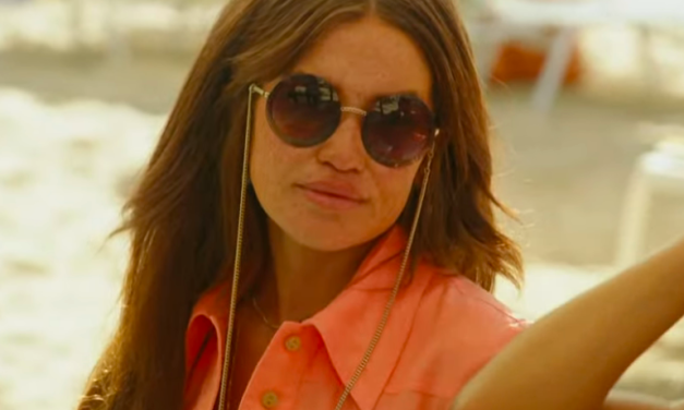 Brynn Whitfield’s Coral Dress and Round Chain Sunglasses