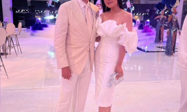 Crystal Kung Minkoff’s White Ruffle Off The Shoulder Dress