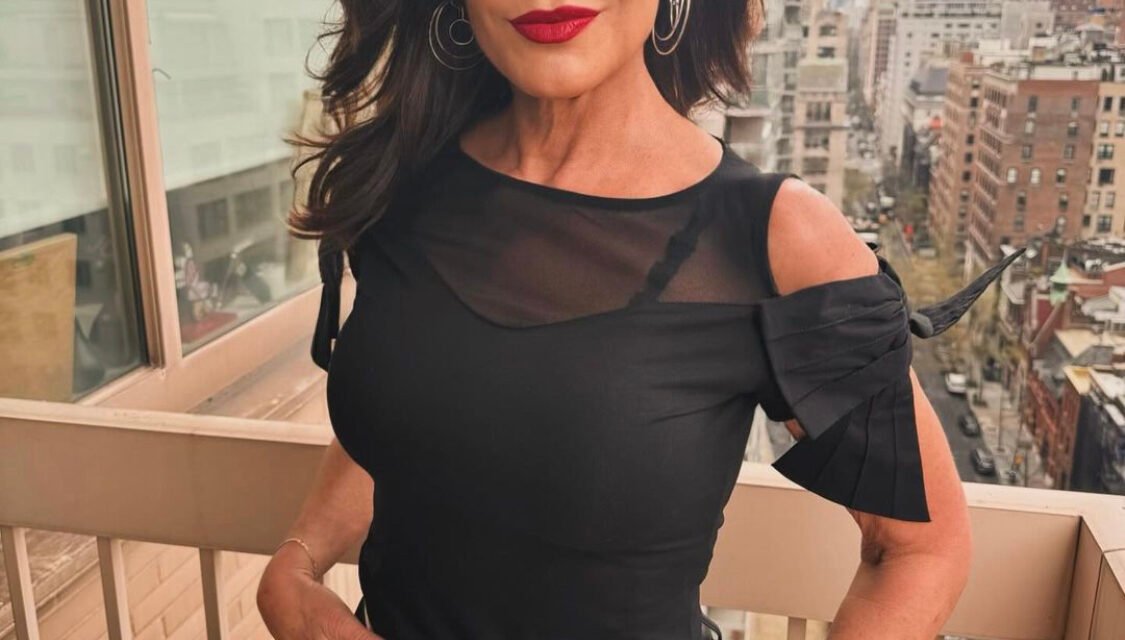 Luann de Lesseps’ Black Cold Shoulder Bow Top