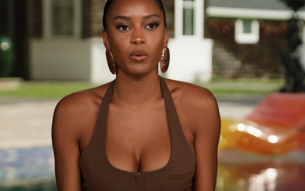 Ciara Miller’s Brown Halter Confessional Vest