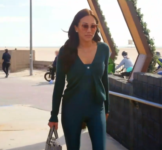 Katie Ginella’s Dark Green Cardigan and Jumpsuit